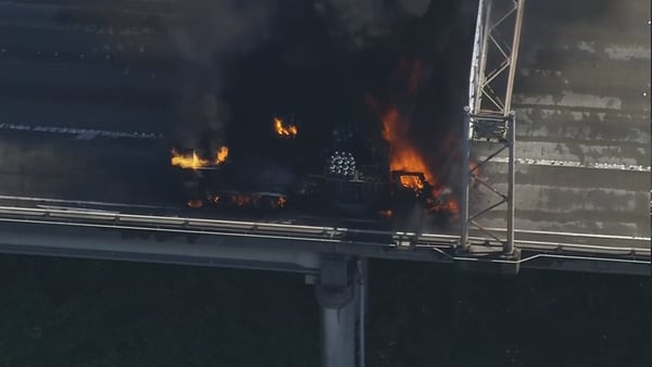 RAW: Truck carrying chemical tanks burning on Interstate 5