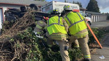 One person trapped in Lacey rollover crash