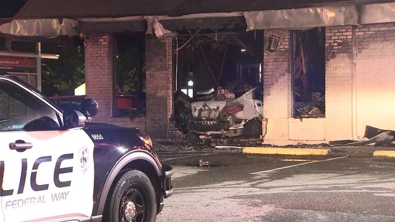 A Federal Way Jack in the Box is in shambles after a car slammed into the side of the restaurant and burst into flames.
