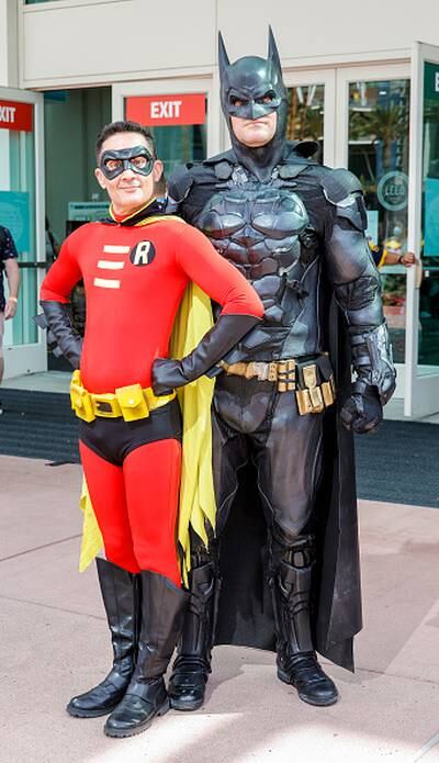 A father and his son cosplay DC character Batman (Left) and Marvel's  Spiderman enemy Doctor Octopus (Right) during the first day of the SOFA  (Salon del Ocio y la Fantasia) 2021, a