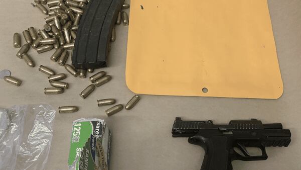 Gun, drugs seized from man found with pants down in stolen truck near West Seattle school