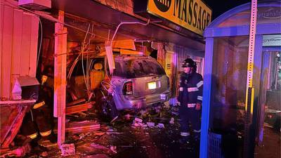 SUV slams into massage parlor in Everett, driver suspected of DUI