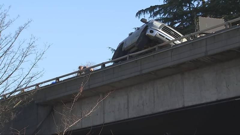 The truck is on southbound I-5 near Mercer Street, which is an elevated section of the freeway.