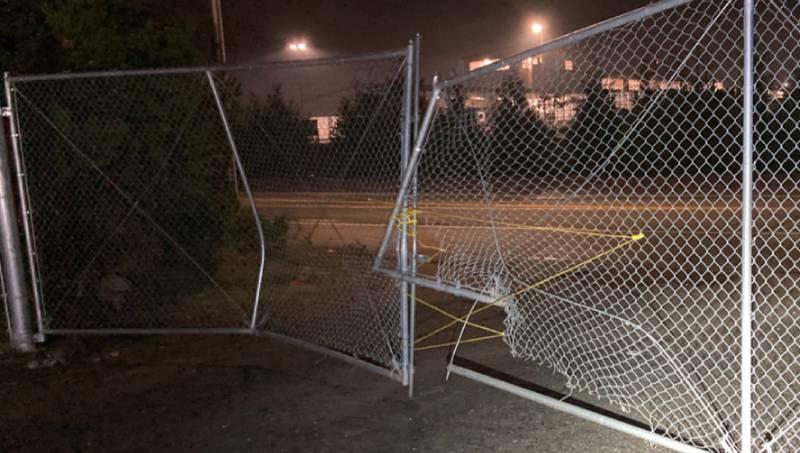 A gate was rammed by a vehicle to get inside the lot.