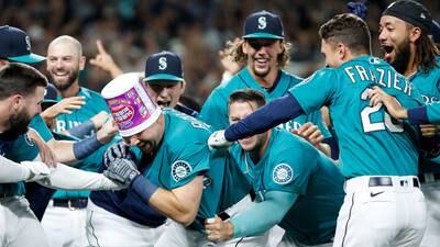 PHOTOS: Mariners clinch playoff spot after win over Athletics