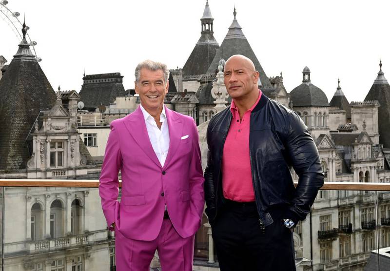 LONDON, ENGLAND - OCTOBER 17:  Pierce Brosnan and Dwayne Johnson aka The Rock attend the "Black Adam" photocall at The Corinthia Hotel on October 17, 2022 in London, England. (Photo by Kate Green/Getty Images for Warner Bros.)