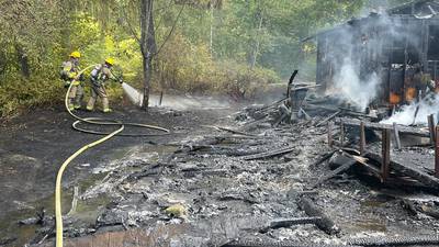 PHOTOS: Fire destroys outbuilding in Battle Ground