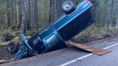 Collision on Chinook Pass strands car upside down