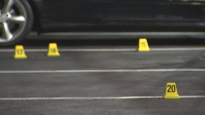 Dozens of evidence markers are strewn around the scene of an incident at a Kent motel.