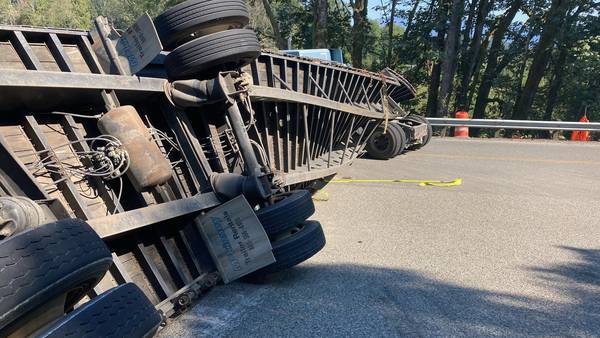 Rolled semitruck trailer fully blocking SR-9 through Skagit County