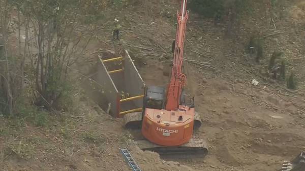 Crews in Bellevue start digging to expose broken water main, search for answers