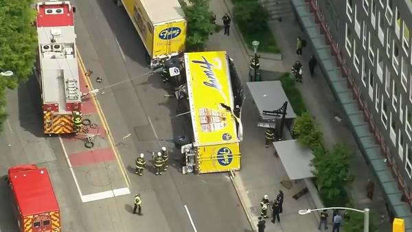 RAW: Bread truck overturns onto Seattle street