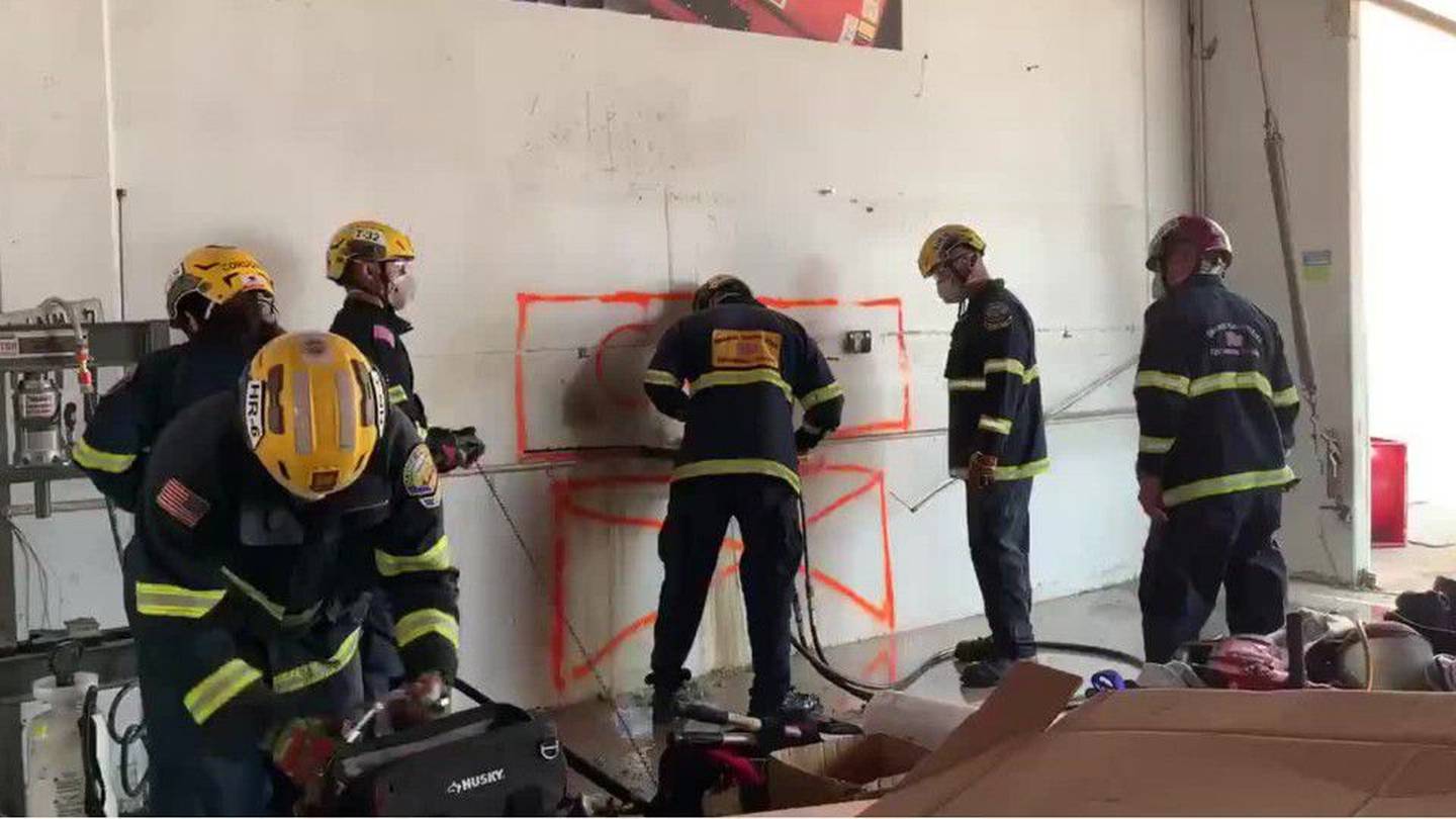 California Firefighters Rescue Naked Woman Wedged Between Two Buildings