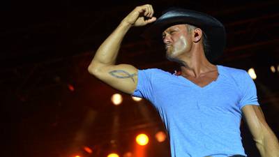 Country music singer Tim McGraw wearing his dad's jersey at the Philli