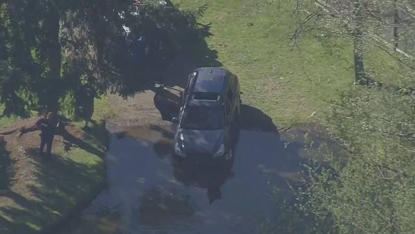Man dead after driving car into South Hill retention pond