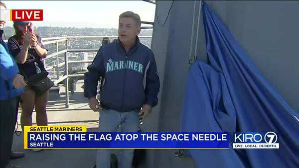 Rick Rizzs raises Mariners flag atop Space Needle