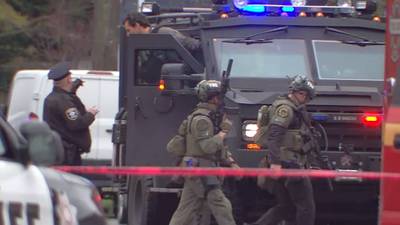 PHOTOS: King County detective shot, standoff with suspect in Ballard