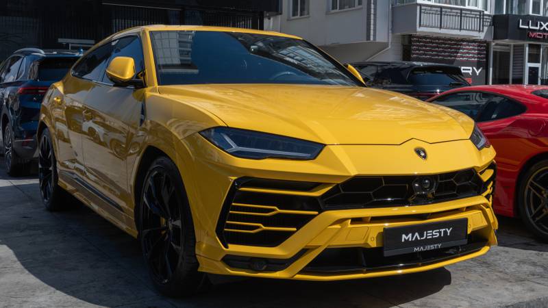 A yellow Lamborghini Urus
