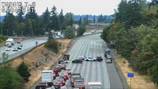 Police vehicle used to push flipped car out of I-5 in Federal Way