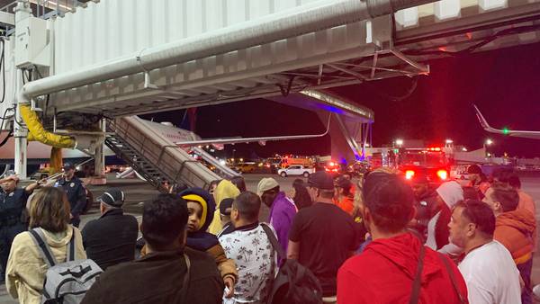 Slides deploy, passengers evacuate when smoke begins upon landing at Sea-Tac