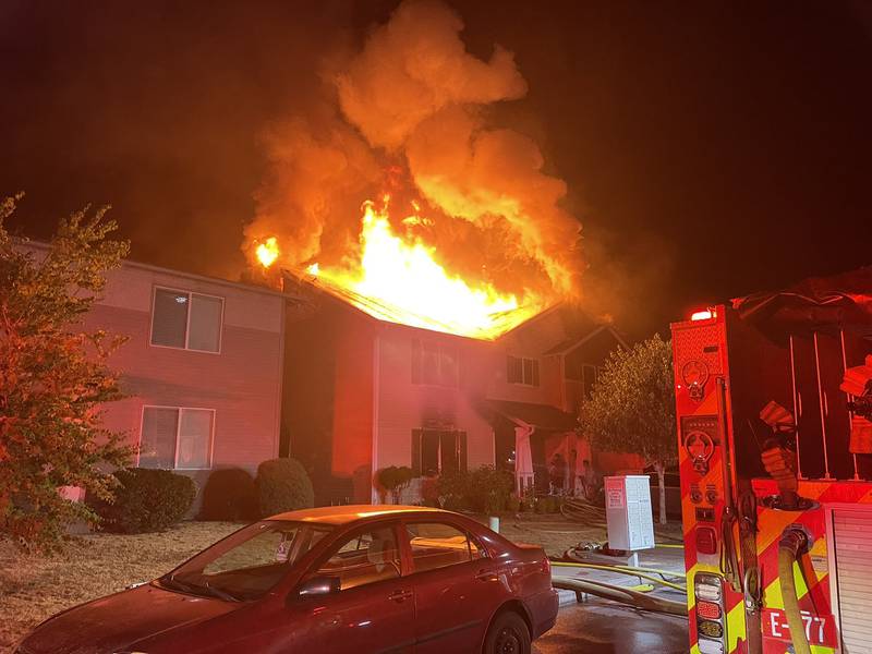 The intense radiant heat from the fire caused damage to the homes on either side.