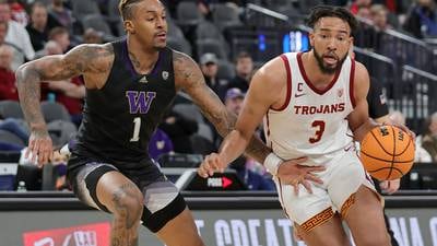 No. 21 USC holds off Washington 65-51 in Pac-12 quarters