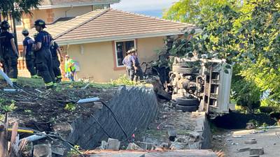 PHOTOS: dump truck crashes into Edmonds home