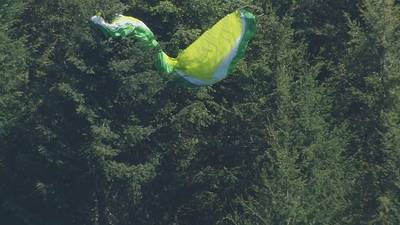 Crews rescue paraglider stuck in tree near Poo Poo Point