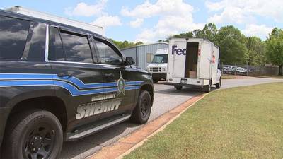 FedEx driver shot at after running over family’s dog; mother, son arrested, authorities say