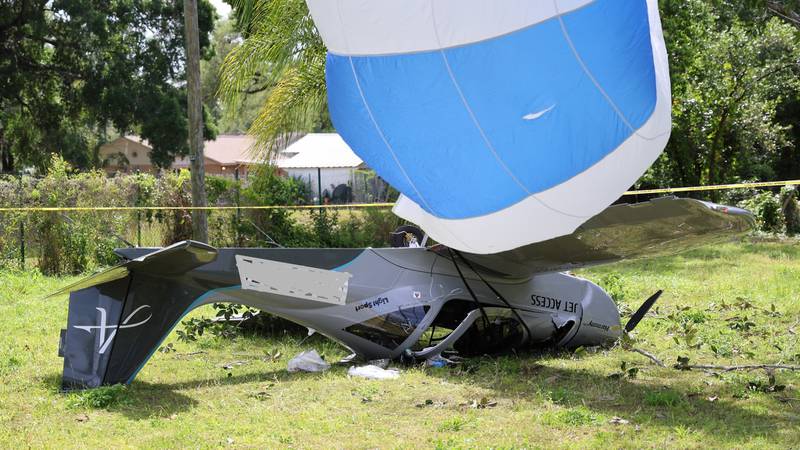 Upside down plane with parachute deployed