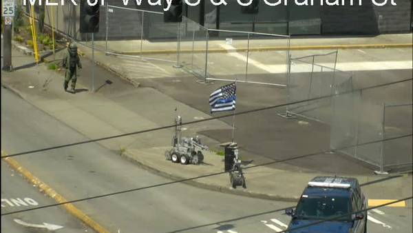 Seattle police investigate suspicious barrel with a Thin Blue Line flag on it
