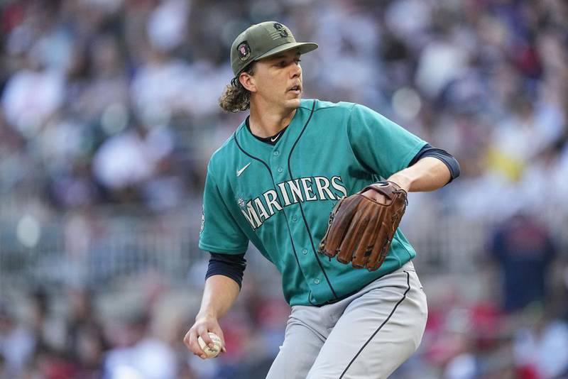 Seattle Mariners starting pitcher Logan Gilbert prepares to deliver in the first inning of a baseball game against the Atlanta Braves , Saturday, May 20, 2023, in Atlanta. (AP Photo/John Bazemore)