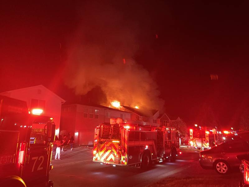 The intense radiant heat from the fire caused damage to the homes on either side.