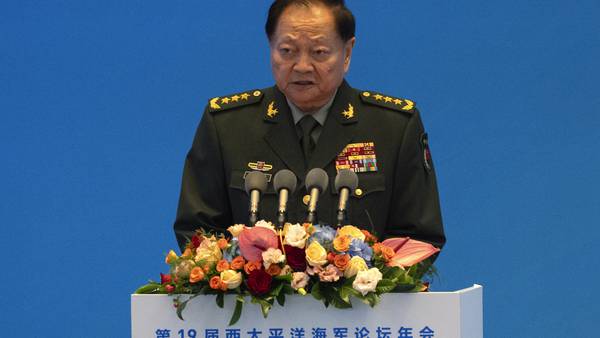 Chinese general takes a harsh line on Taiwan and other disputes at an international naval gathering