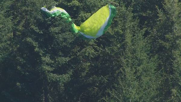Crews rescue paraglider stuck in tree near Poo Poo Point