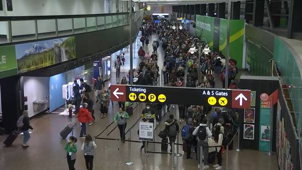 Sea-Tac Airport security lines stretch into parking garage two mornings in a row