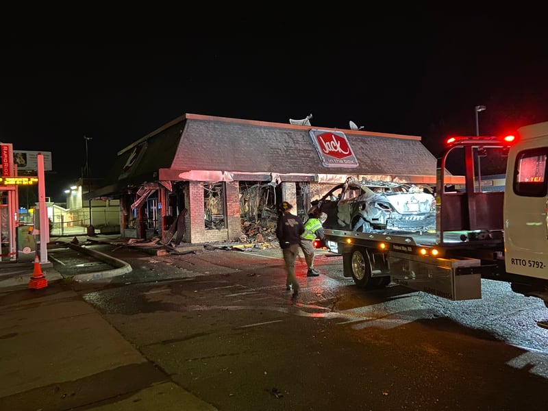 A Federal Way Jack in the Box is in shambles after a car slammed into the side of the restaurant and burst into flames.