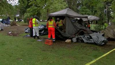 City crews sweep encampment at Woodland Park