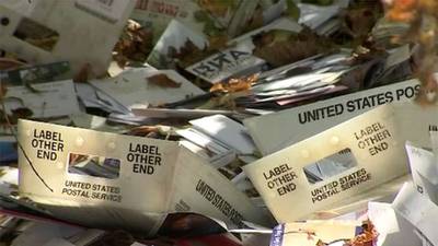Piles of mail dumped in woods; USPS investigating