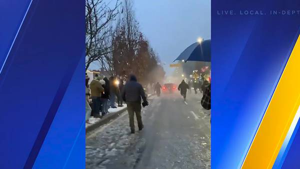 RAW: Man arrested after driving through barricades of Santa parade in Tacoma