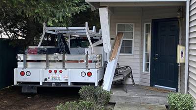 PHOTOS: Man arrested after crashing stolen City of Stanwood work truck into home