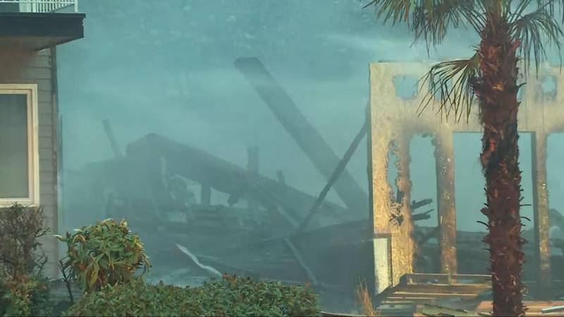 A 3-alarm fire caused a home under construction to collapse and damaged two others in Seattle's Mount Baker neighborhood.