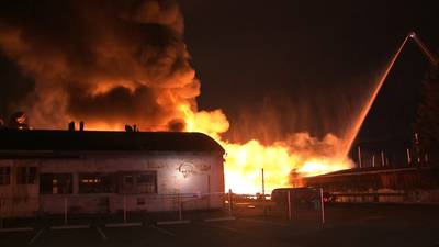 PHOTOS: Warehouse collapses in four-alarm fire in North Queen Anne