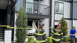 Person injured after driver crashes inside of apartment unit in Puyallup