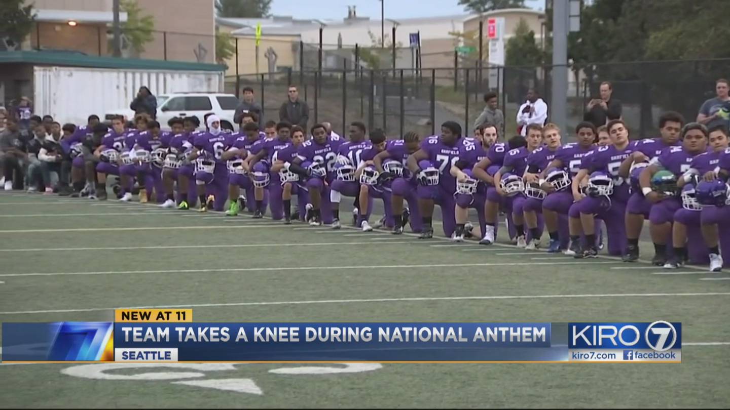 Cherokee football player kneels for national anthem to protest