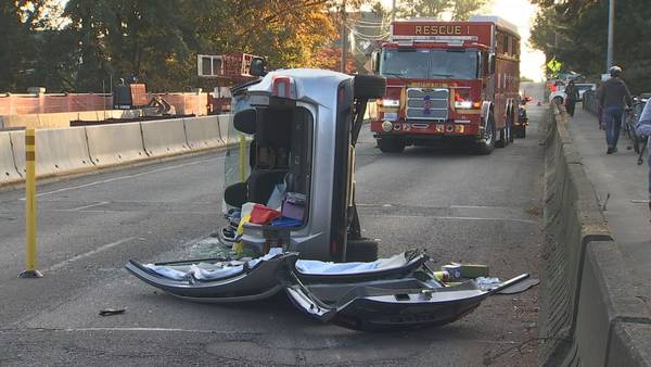 Firefighters cut woman out of car after West Seattle rollover crash