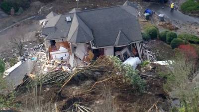 PHOTOS: Bellevue home slides off foundation, collapses