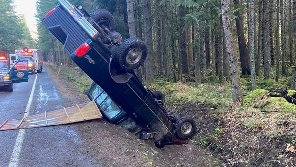 Collision on Chinook Pass strands car upside down