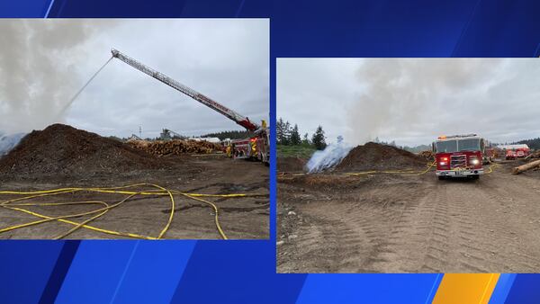 Crews extinguishing fire after large wood pile spontaneously combusted in Spanaway