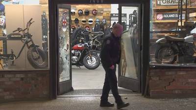 Vehicle smashes in doors at North Seattle motorcycle shop